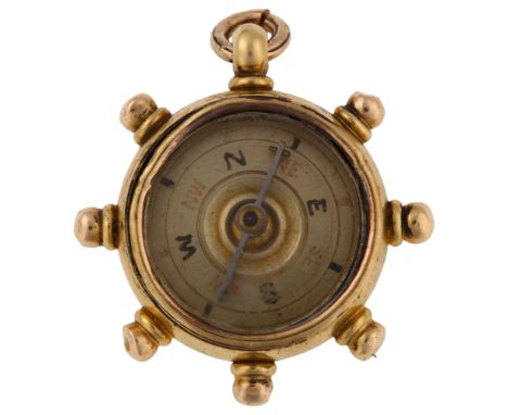A late Victorian 18ct gold carnelian ship's wheel compass fob, maker's marks B and S, hallmarks Birmingham 1899, diameter 30.