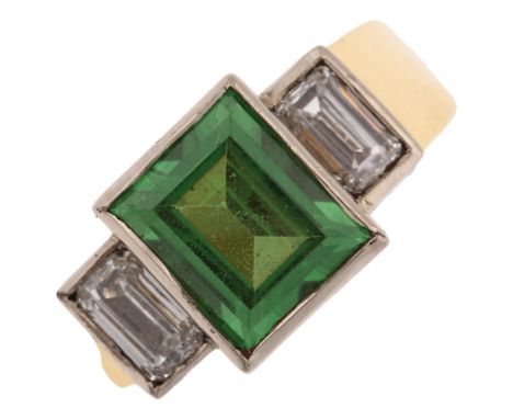 An 18ct gold three stone tsavorite garnet and diamond ring, set with rectangular step-cut green garnet and emerald step-cut d