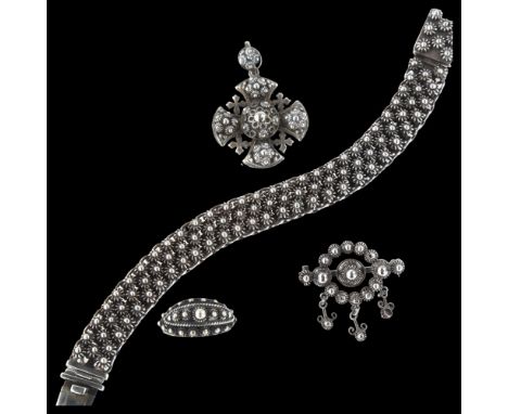 A Danish sterling silver Viking Revival demi-parure, comprising bracelet, pendant, brooch and ring, all with cannetille wirew