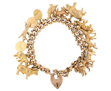 A mid-20th century 9ct rose gold fancy curb link charm bracelet, with 14 x 9ct charms, mostly animals including lion, giraffe