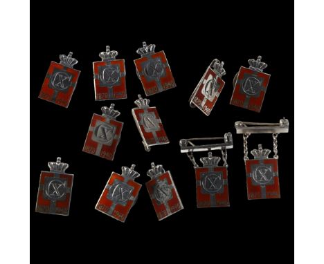 GEORG JENSEN - 12 Danish sterling silver and red enamel Kingmark badges and brooches, height 23.8mm, 40.7gNo damage or repair