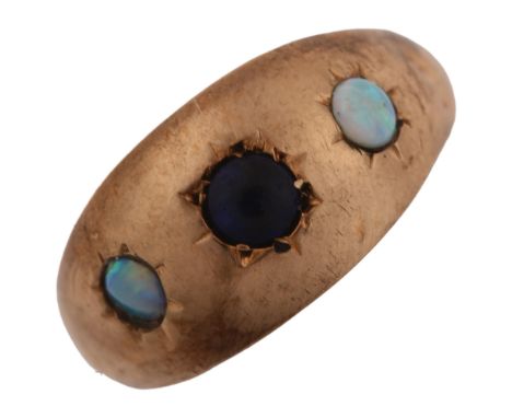 An early 20th century 9ct rose gold three stone opal and blue paste gypsy ring, setting height 9.1mm, size J, 1.4gAll stones 