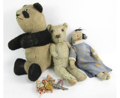 A 20thC Mohair teddy bear, panda, and a selection of other items.