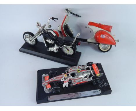 A Hot Wheels Lewis Hamilton racing car, model Vespa, Harley Davidson quartz clock and a model of motorbikes. (a quantity).