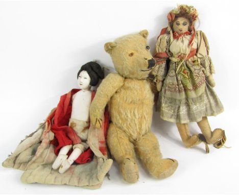 A 19thC style doll, with lace work and dyed garments, human hair, a painted face, a composite Geisha style model, and an earl