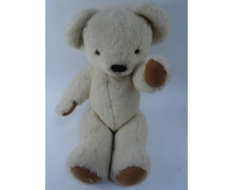 A Merrythought light fur teddy bear, with fabric patches, 66cm.