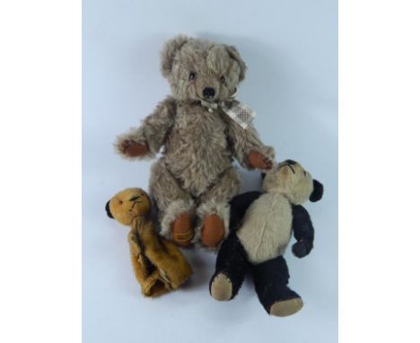 A collection of small teddy bears, including mid 20thC Mohair bear.