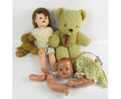 A mid 20thC composite doll, with two similar period teddy bears and doll parts.