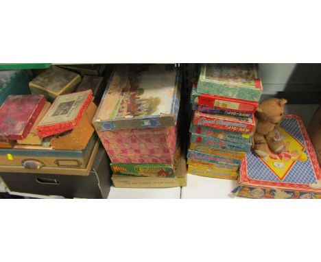 A collection of mid 20thC jigsaws, children's tea service, plywood jigsaws etc. 