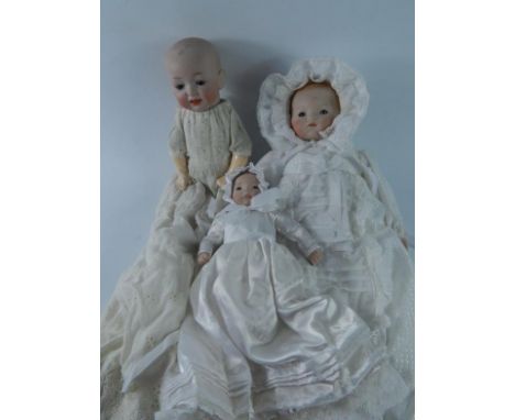 A collection of composite doll parts and complete dolls, (contents of one shelf).