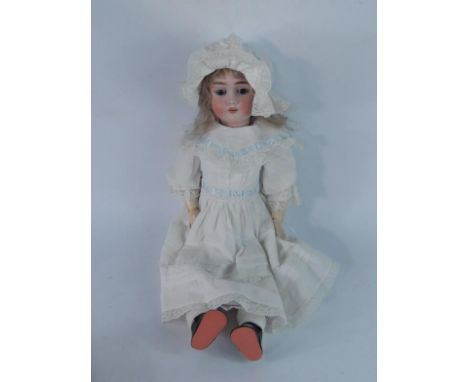 A Max Handwerck bisque head doll, no. 2.25, sleeping eyes, mohair wig, open mouth, moulded teeth, jointed composition body.