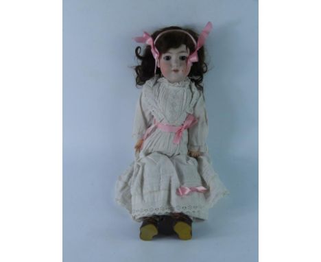 An Armand Marseilles bisque headed doll, DRGM 246/1, A.7.M, with open eyes and mouth, mohair wig, jointed composite body, 57c