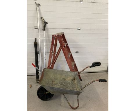 A metal wheelbarrow with a set of metal folding steps, a telescopic lopper &amp; a set of drain rods. Wheelbarrow has black p