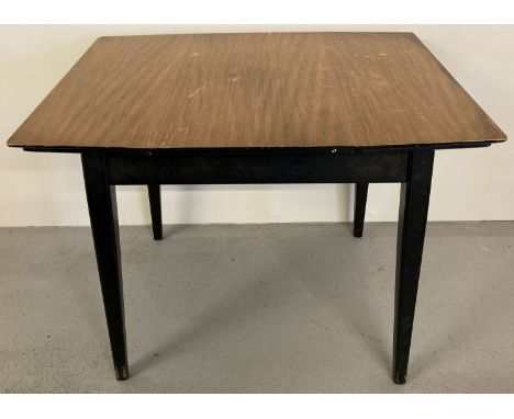 A vintage 1960's teak draw leaf kitchen table with veneered top and with ebonised legs and frame.  Approx. 74.5cm tall, top a