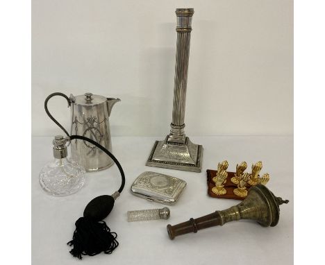 A collection of vintage silver plate and metal ware items. To include a stepped base column design candlestick, coffee pot, c
