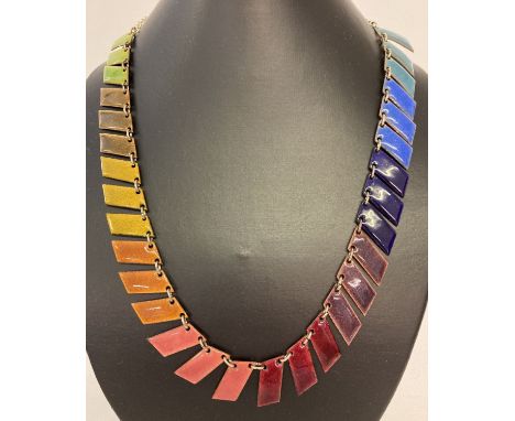 A hand crafted modern design multi coloured enamel necklace with magnetic clasp.  Approx. 22 inches long.