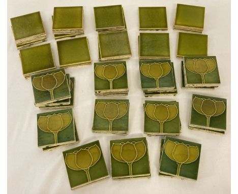 26 Art Nouveau green glaze flower design ceramic tiles by Minton China Works. Together with 20 small plain green glaze tiles.