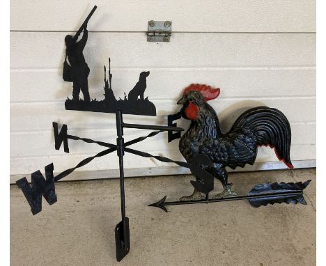 A black metal weather vane with gamekeeper and gundog shaped finial. Together with a painted black and red part weather vane 
