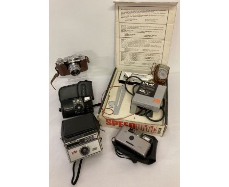 A collection of vintage cameras and accessories. To include a Halina 35X camera. Lot also includes Kodak Instamatic 100, Olym