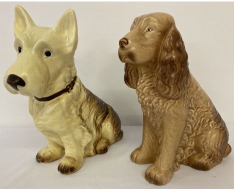 2 Sylvac ceramic dog figurines. A brown spaniel and a yellow and brown terrier.  Largest approx. 29cm tall.
