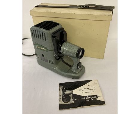 A vintage Liesegang Fanti slide projector with wooden carry box and instruction book.  