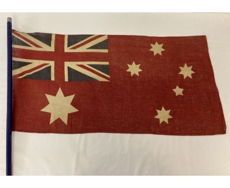 A vintage British Empire Australian red ensign flag on a modern wooden pole. Depicting unions flag, 1 large and 4 smaller 7 p