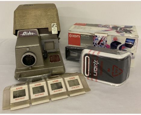 A vintage Aldis 303 slide projector and a sleeve of 11 slides. Together with a boxed in original packaging Ion Slides 2PC 35m