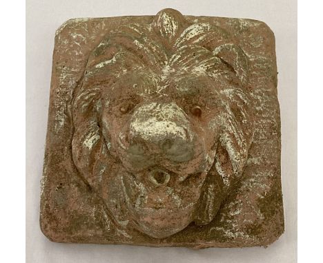 A vintage stoneware lions head garden wall plaque.  Approx. 21cm x 20cm.