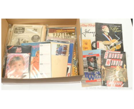 Quantity of Western and Country music programmes, newspaper magazines and book includes Johnny Cash Europe 84 with ticket stu