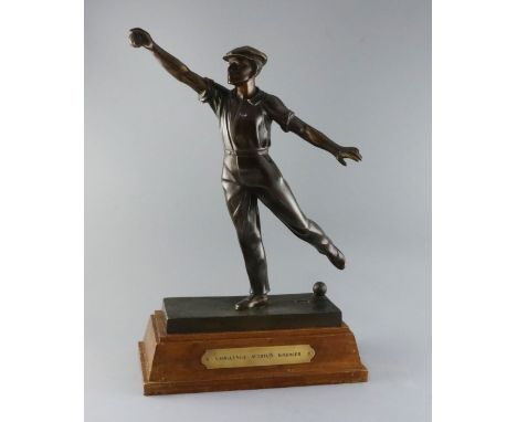 Émile Grégoire (1871-1948). A bronze boulle trophy, depicting a boulle player about to cast a throw, signed in the bronze, on