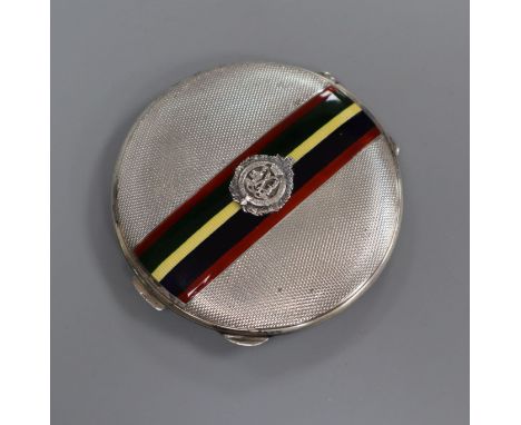 A 1930's silver and enamel compact with 'Sutherland and Argyle' applique, 75mm.