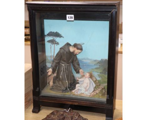 An early 20th century Italian religious diorama depicting Saint Francis and the infant Jesus before a painted seascape height