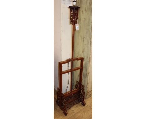 A Chinese carved hardwood telescopic standard lamp