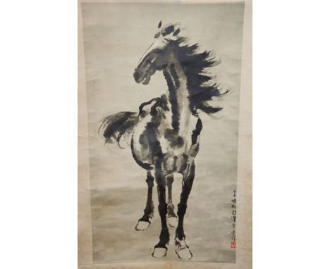 A Chinese scroll painting of figures in a landscape, and two other scrolls