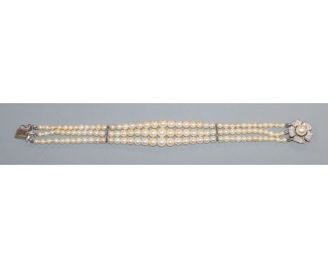 A graduated cultured pearl bracelet with diamond and cultured pearl set white metal clasp, 18cm.