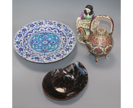 A Continental porcelain figure of a flower seller, a Satsuma teapot and cover and two dishes