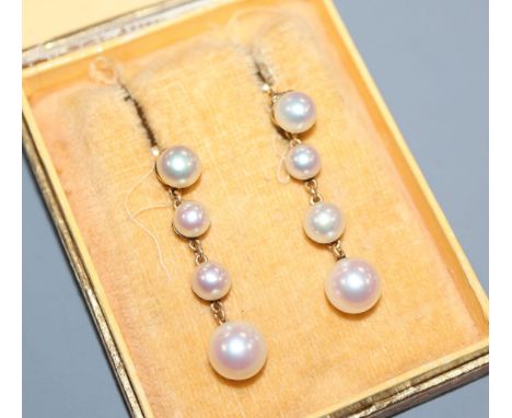 A pair of 1950's Swedish 18k and graduated cultured pearl drop earrings, drop 34mm.