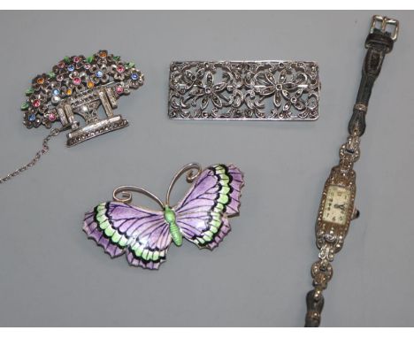 A George V silver and three colour enamel butterfly brooch, a 935 cocktail watch and two marcasite brooches including giardin