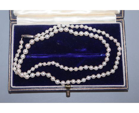 A single strand graduated cultured pearl necklace, with white metal clasp, 44cm.