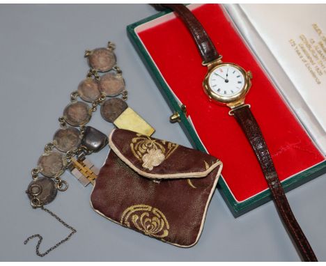 A gentleman's early 20th century 15ct gold manual wind wrist watch and a coin bracelet.