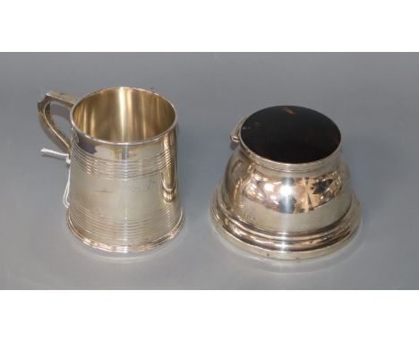 An Edwardian silver christening mug, Goldsmiths &amp; Silversmiths Co Ltd, London, 1903 and a silver mounted inkwell.