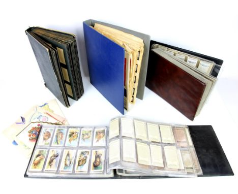 Two albums of cigarette cards, including Players, characters from Thackeray, ring binder album of cards and a empty album