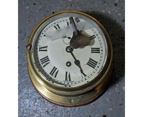 Brass bulkhead clock, Roman numeral chapter ring, painted dial, subsidiary seconds dial, on wooden back, 22cm diameter, toget