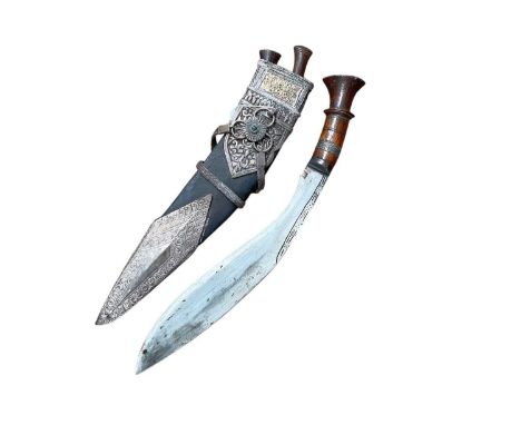 Good quality Gurkha kukri with wood hilt, in leather scabbard with ornate silver mounts, with the blade 28cm in overall lengt