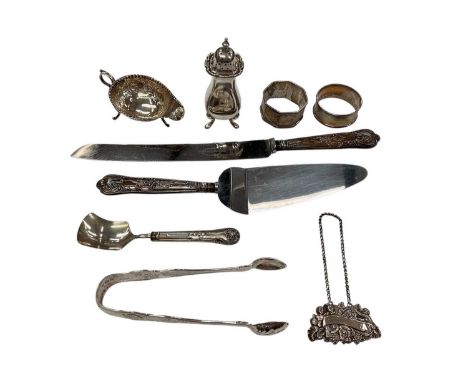 Victorian silver kings pattern sugar tongs (London 1894), together with a George V silver pepperette (Birmingham 1923), silve