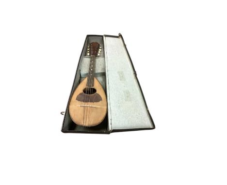 Mandolin in case, together with a collection of antique and vintage sheet music