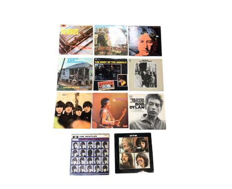 Group of records, including several Beatles, Jimi Hendrix, Bob Dylan, et