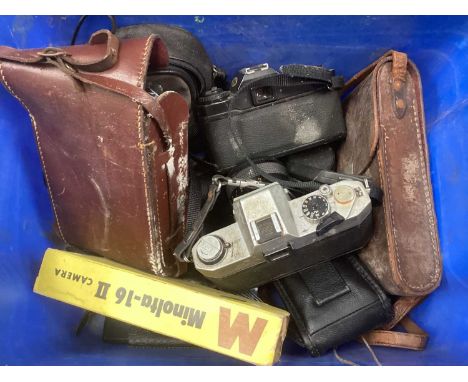 Collection of cameras and accessories, including Minolta, Yashica, etc