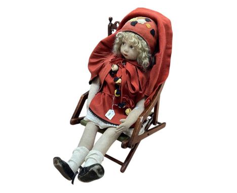 Large Lenci felt doll, moulded and painted facial features, curly blonde hair, zigzag stitching to back of head, separate fin