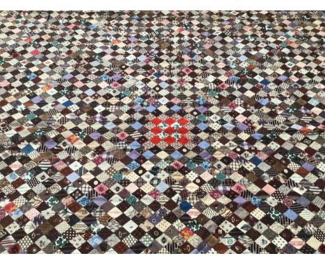 Antique Patchwork quilt made up from very small patches mainly printed cotton. Handstitched. 200cms x 240cms, approximately.O